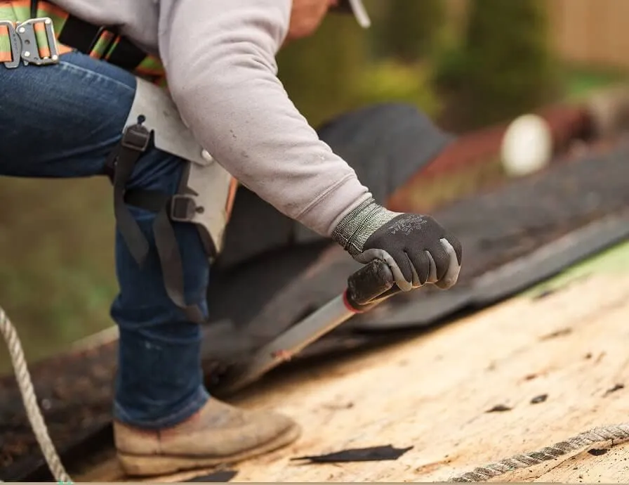 Roofing professional working on a roof